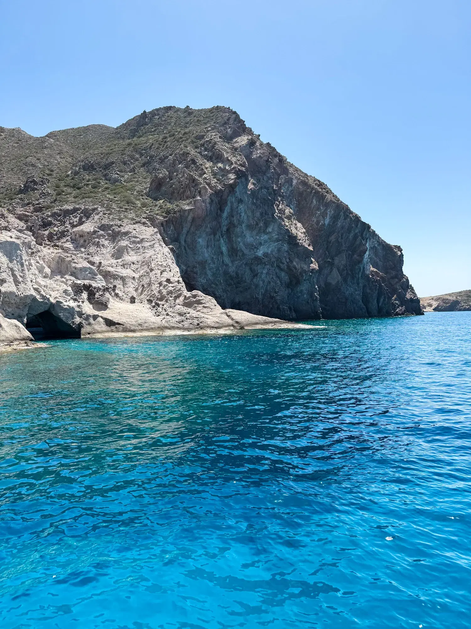 Boat in clear shallow water near the shore
