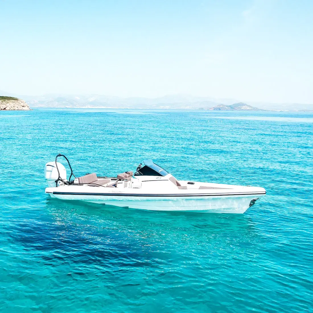 Cruising across bright Aegean water